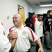 Milan head coach Josh Tropea embraces another coach after defeating Gibraltar Carlson on Monday, March 11. Daniel Brenner I AnnArbor.com